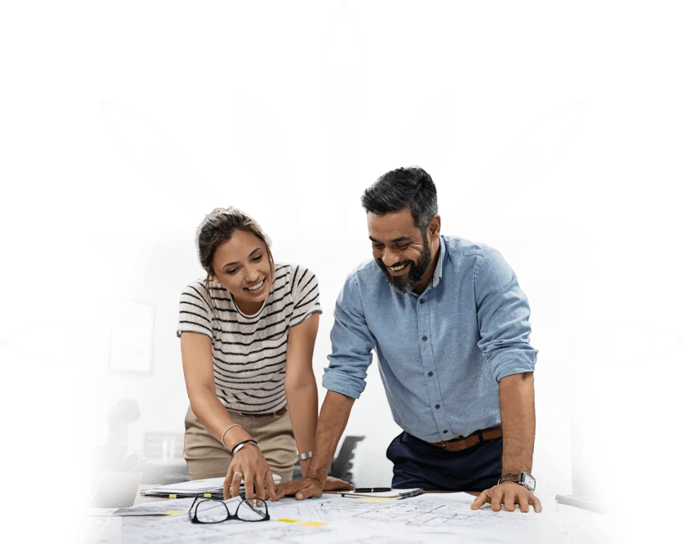 casual dressed construction team smiling in front of charts