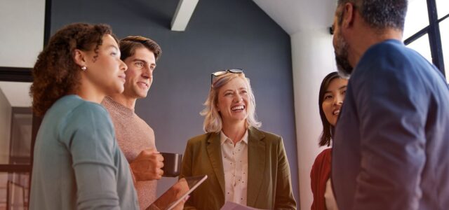 smiling group circle within office