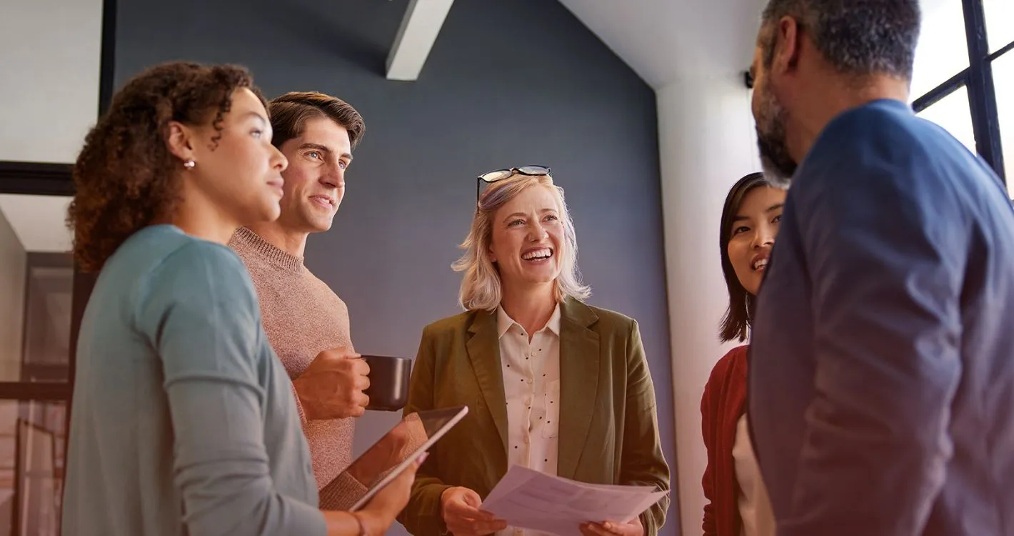 smiling group circle within office