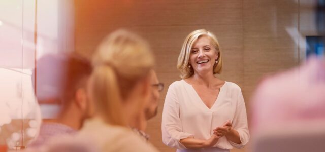 smiling and confident woman presenting