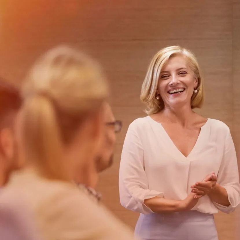 smiling and confident woman presenting