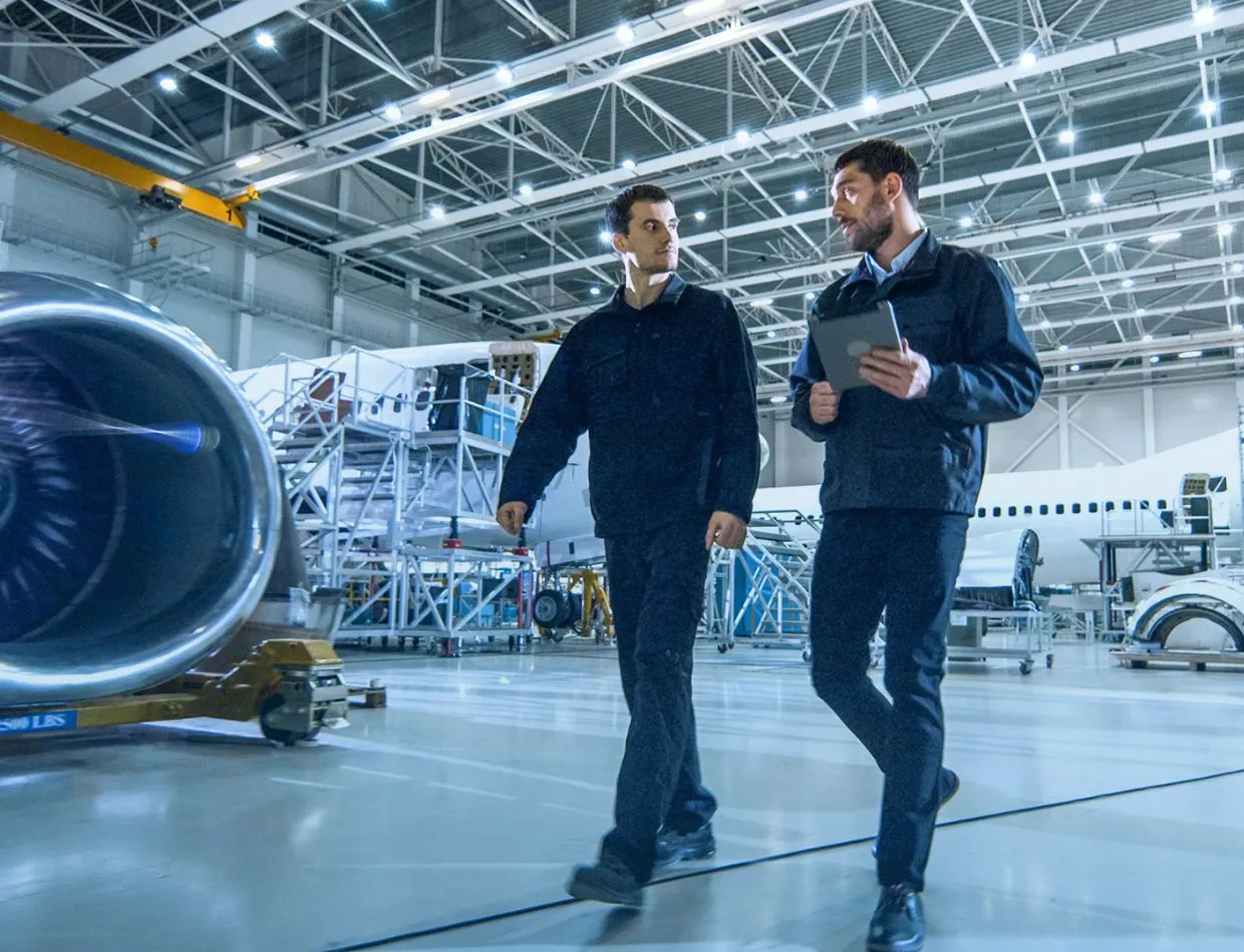 two aerospace officials in hangar