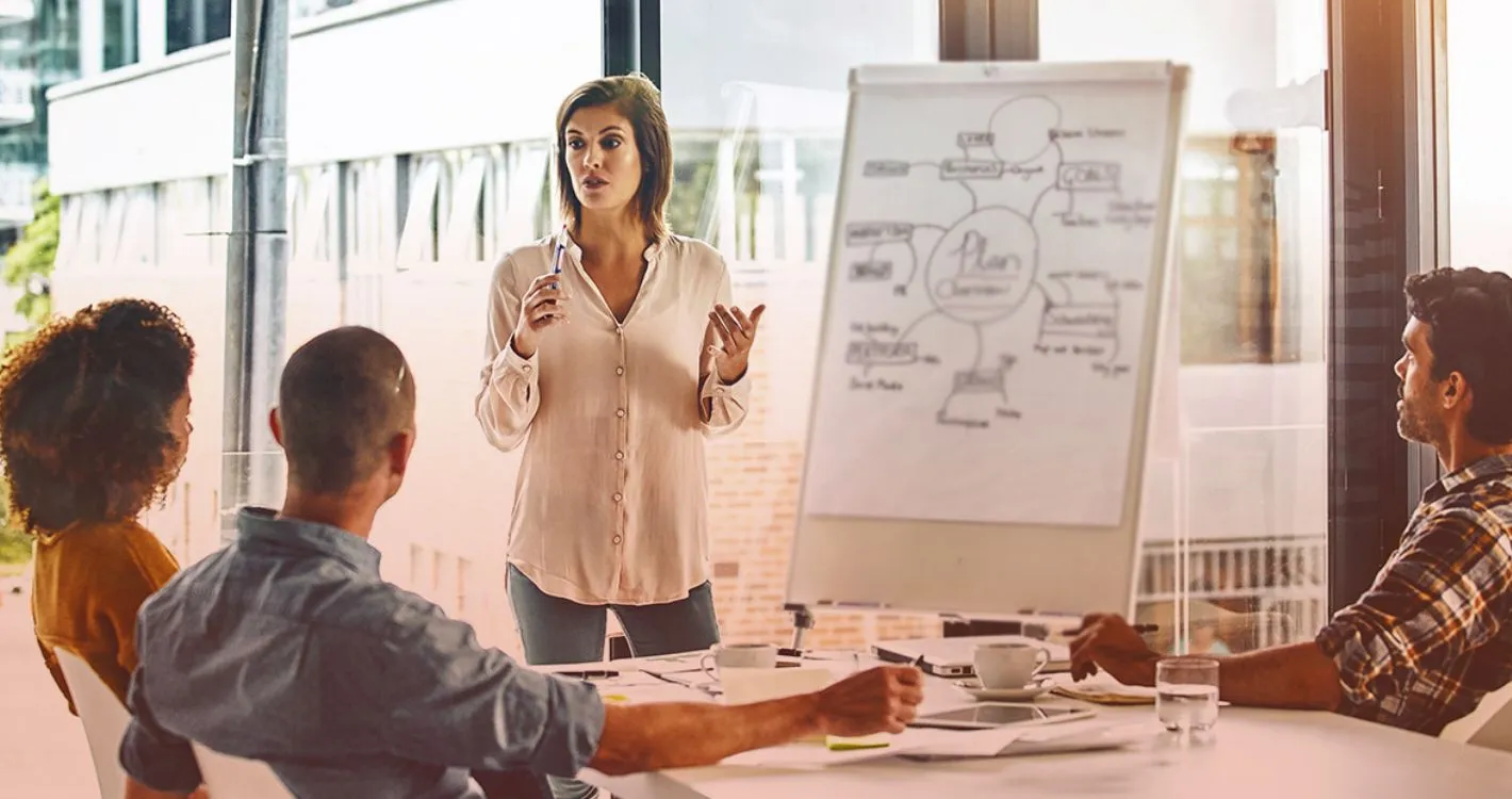 woman presenting to colleagues