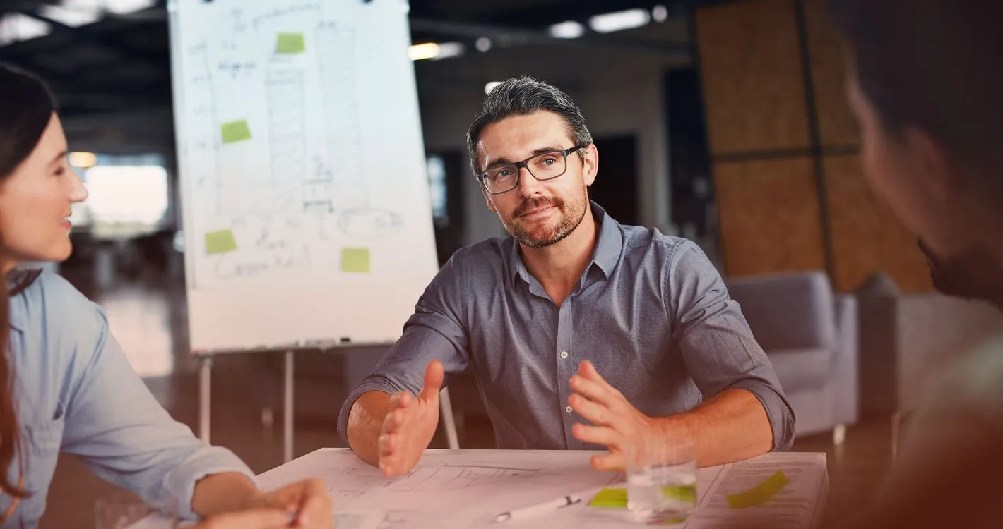confident man sharing insights in office