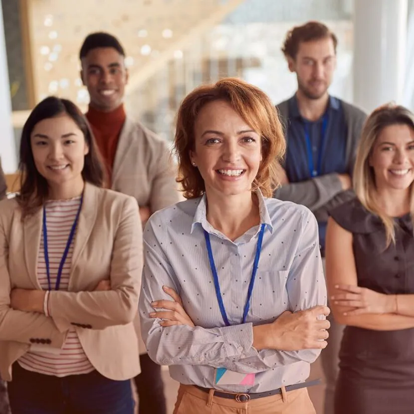 smiling group photo with arms crossed