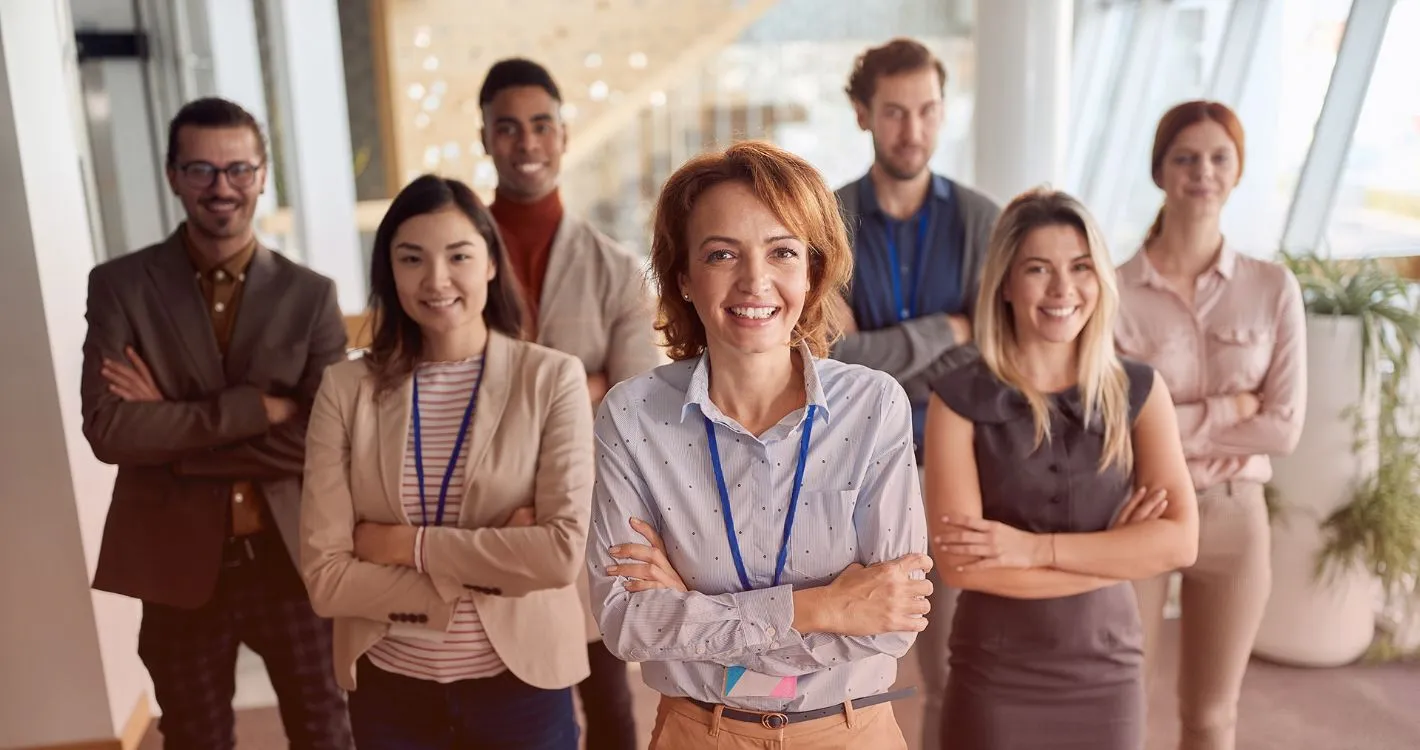 smiling group photo with arms crossed