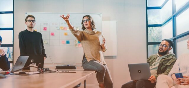 woman dramatically presenting in office