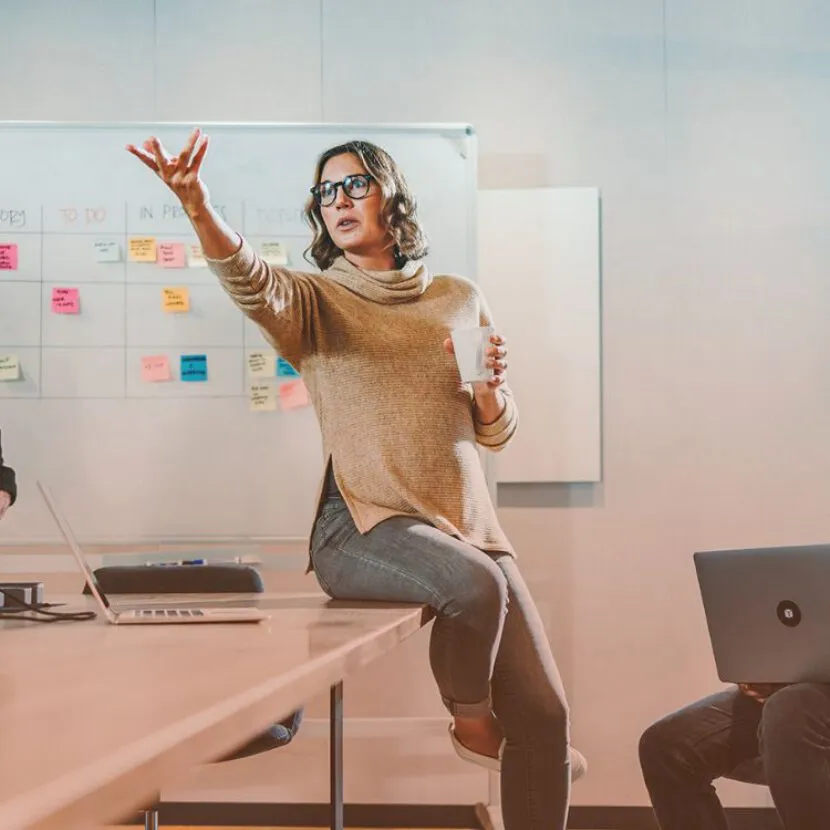 woman dramatically presenting in office