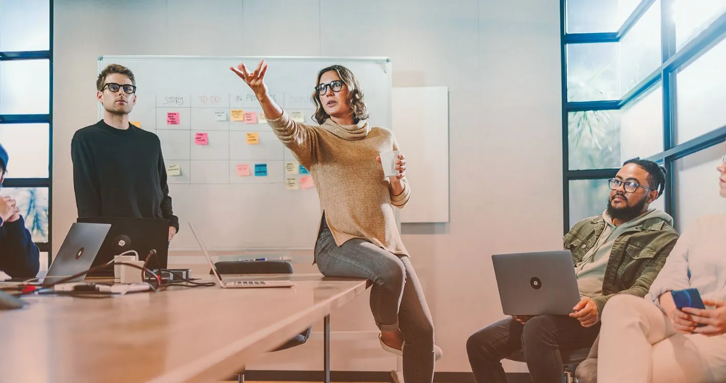 woman dramatically presenting in office