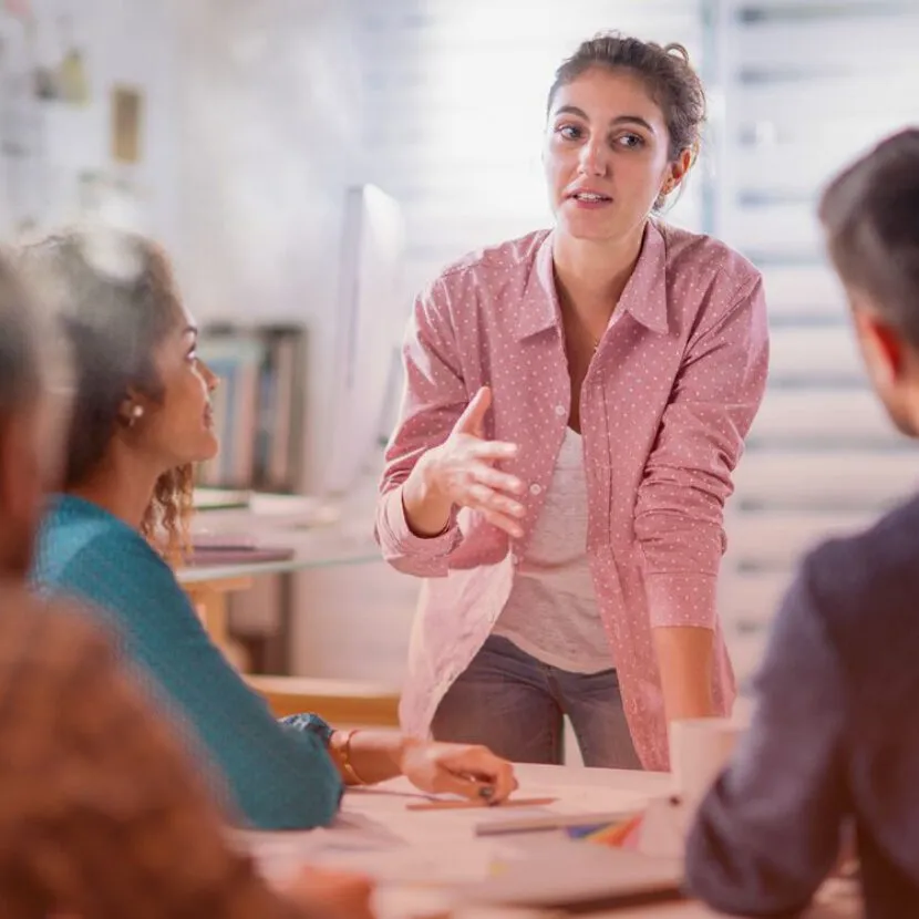 woman delegating to team