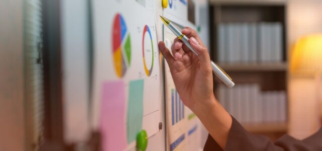 jotting notes on charts in office