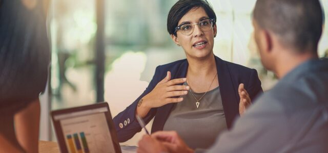 female speaker explaining point