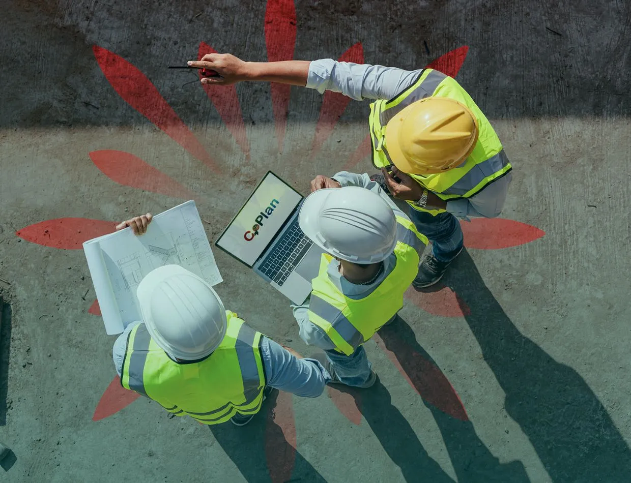 surveyors and architects onsite comparing drawings