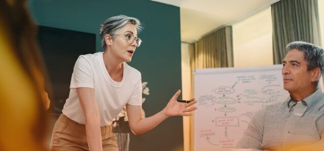 conversing in front of whiteboard