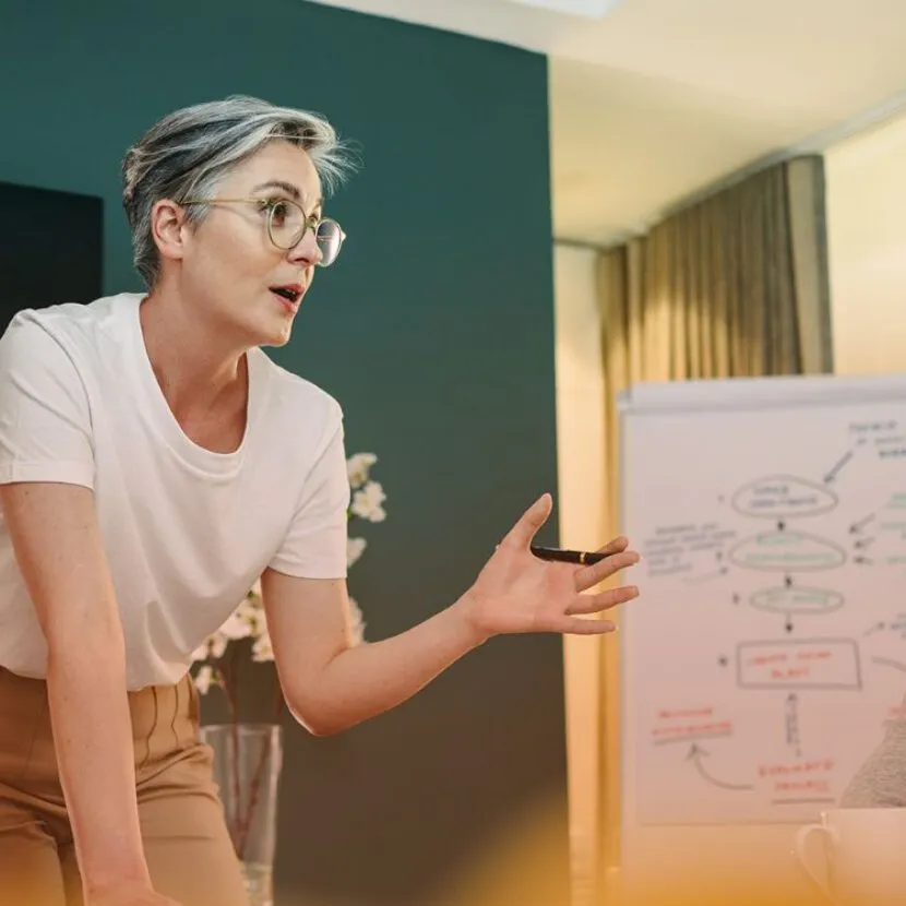 conversing in front of whiteboard