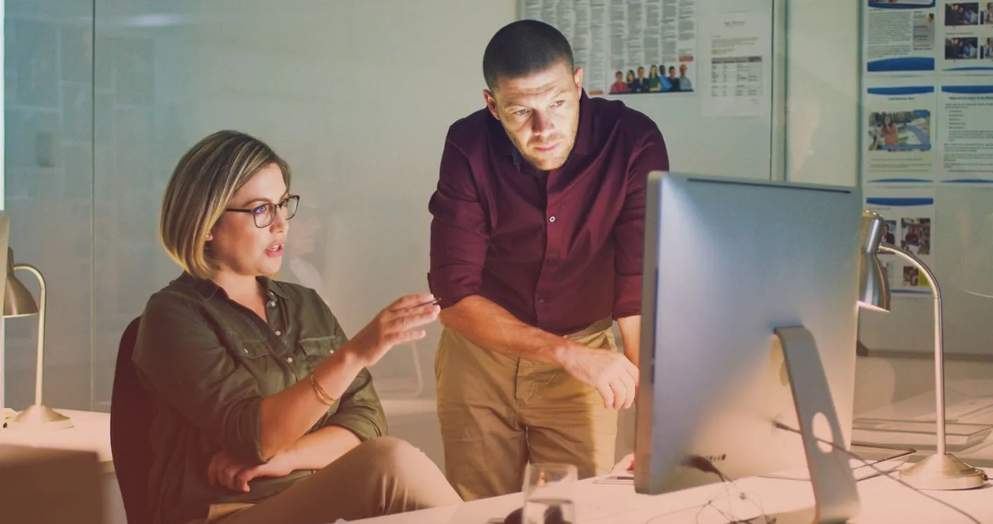 deep in thought individuals around computer