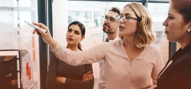 female leader sharing insights with team
