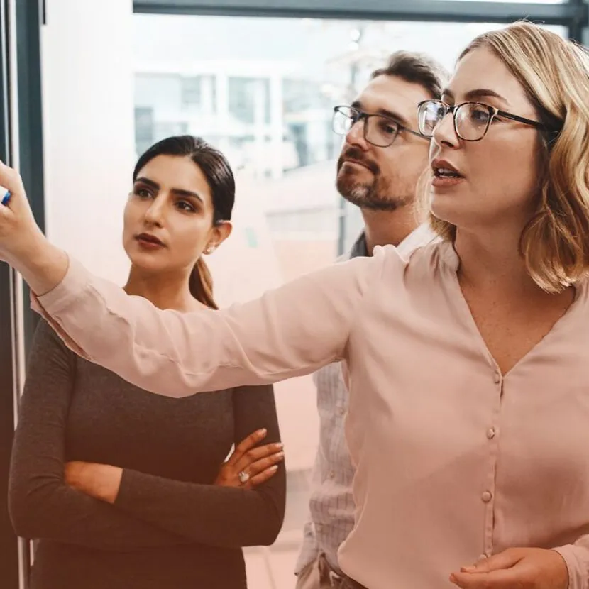 female leader sharing insights with team