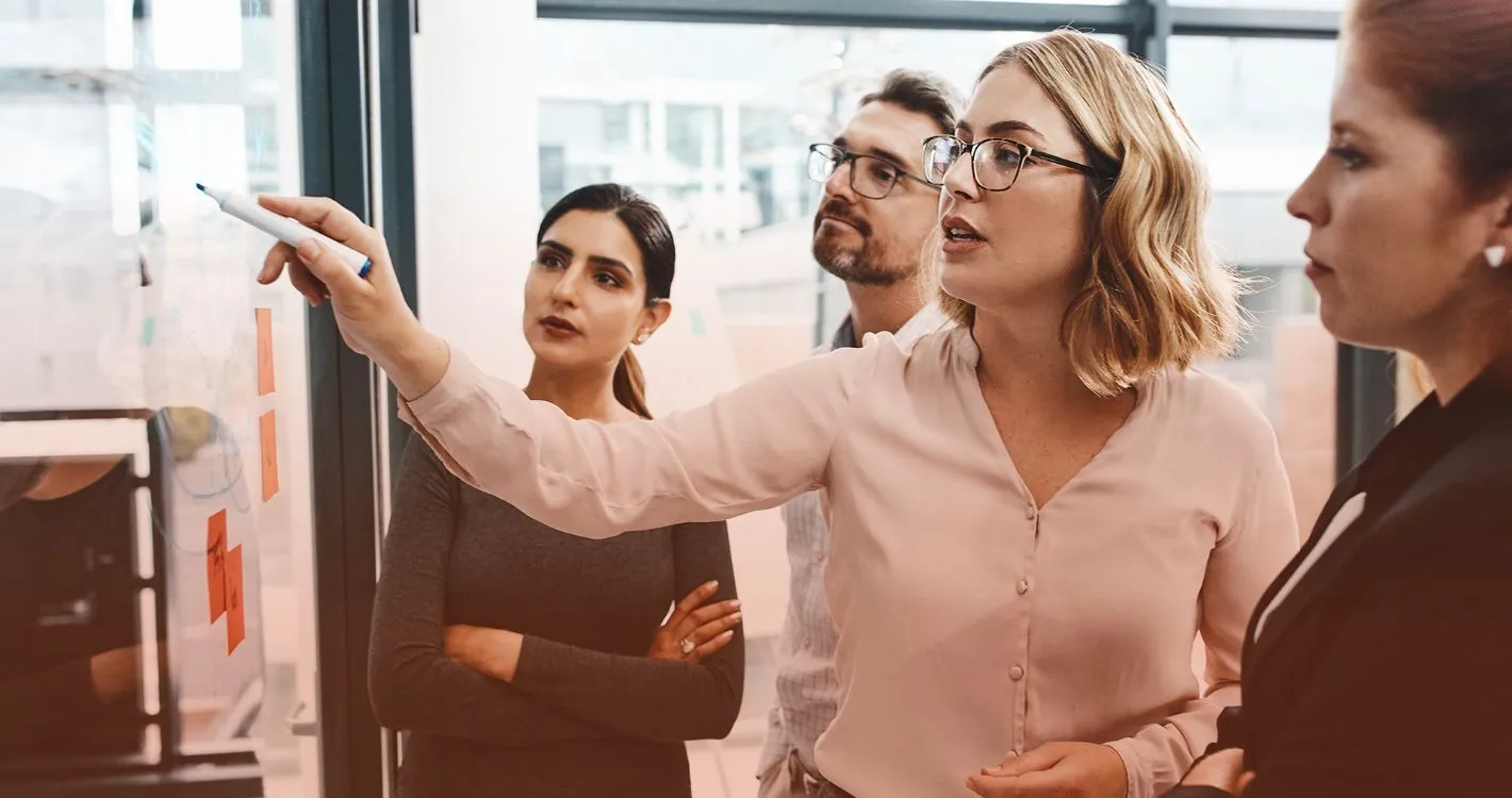 female leader sharing insights with team