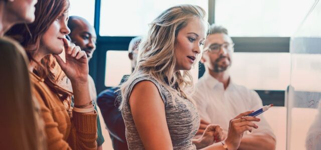 woman writing on whiteboard