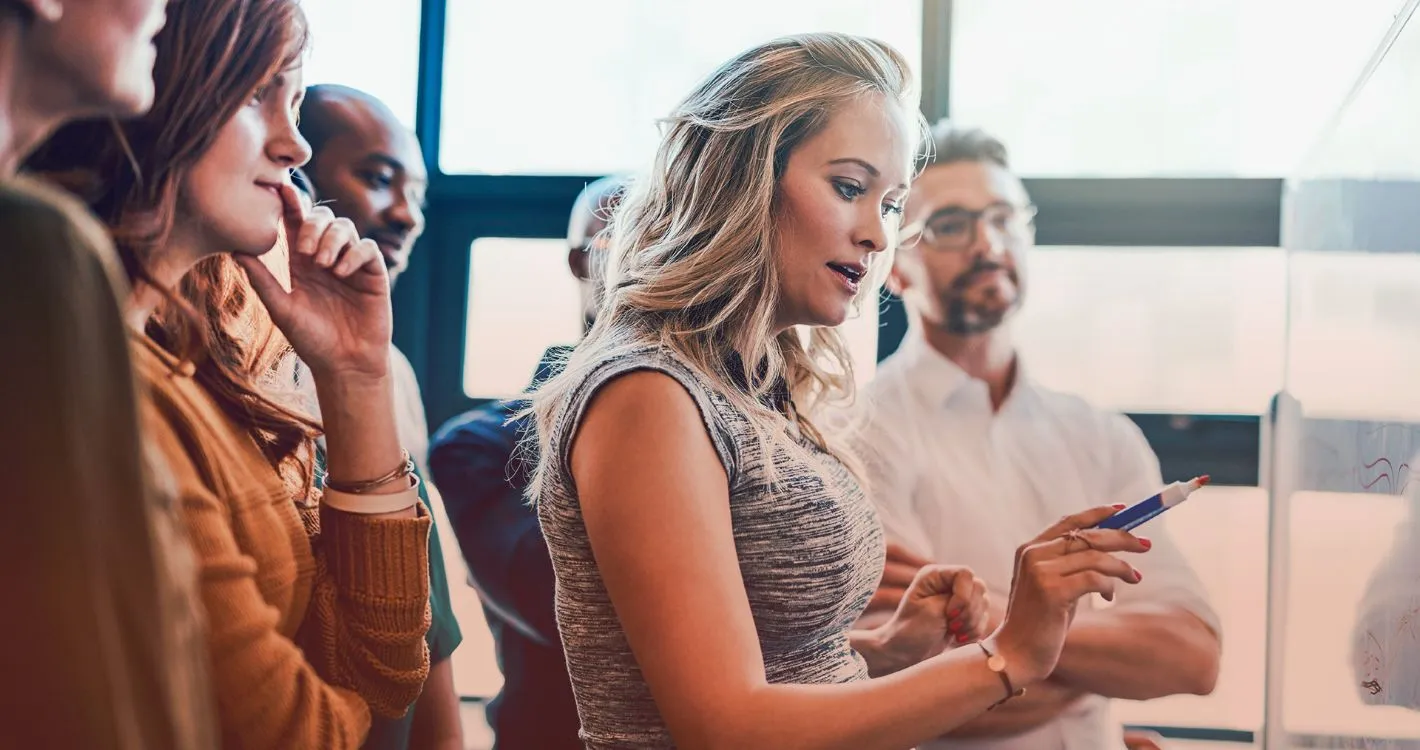 woman writing on whiteboard