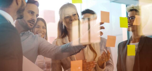 team using post-it notes in office