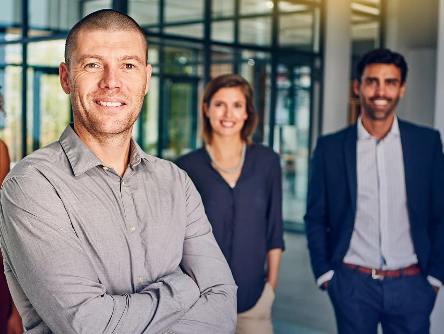 smiling staff outside offices