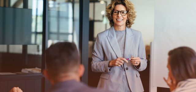 confident woman speaking to group