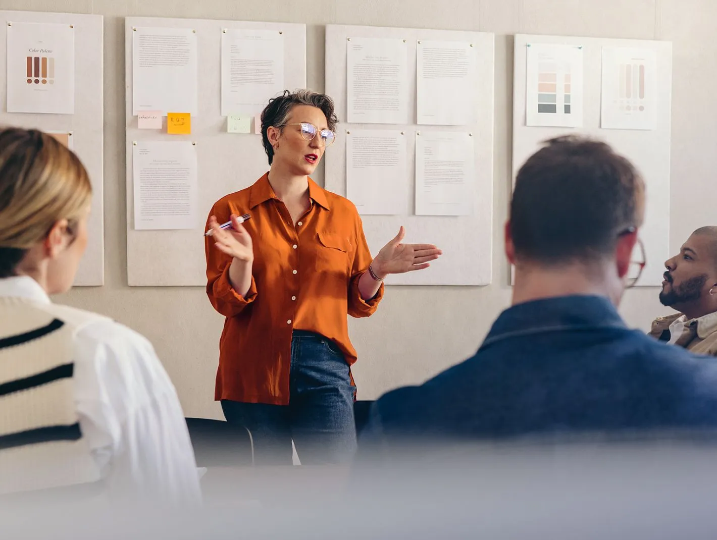 woman presenting to team