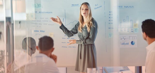 woman presenting risk assessment to team