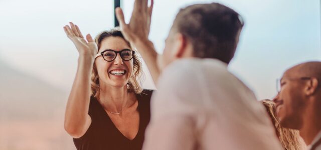 staff high-fiving each other